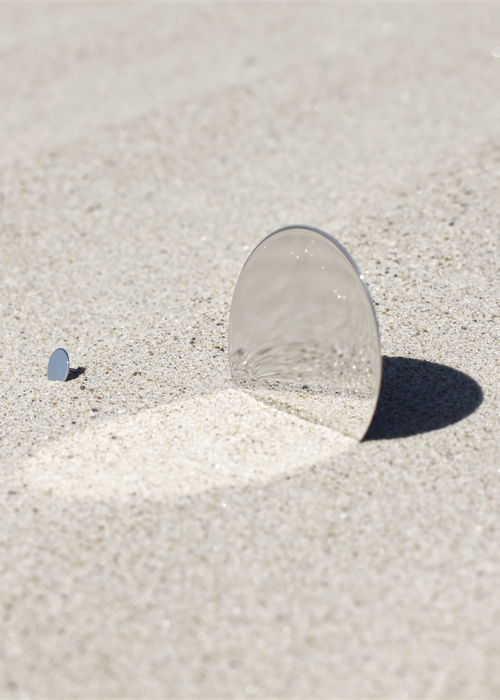 mirror-polished silver earrings in sand