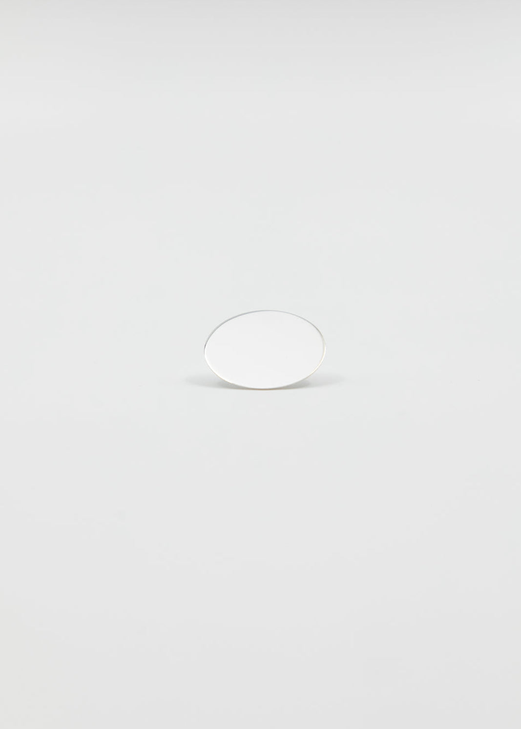 Small silver earstud on a light background