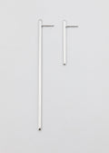 Pair of silver hoop earrings on a light gray background