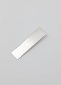 Rectangular silver earring on a light gray background
