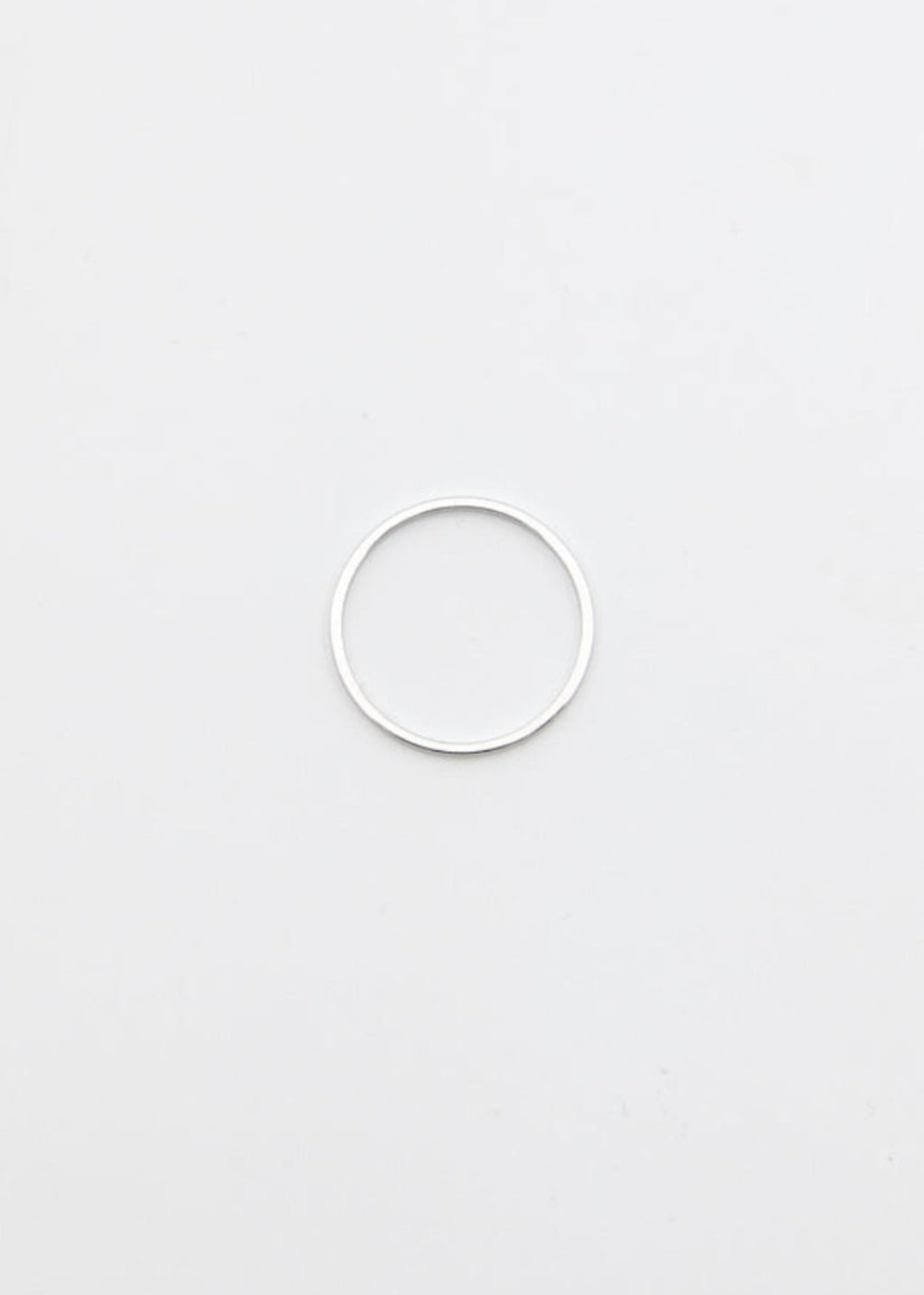 silver ring thin on a light grey background