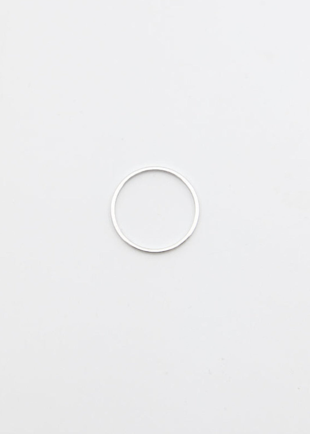 silver ring thin on a light grey background